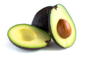 A fresh avocado cut in half